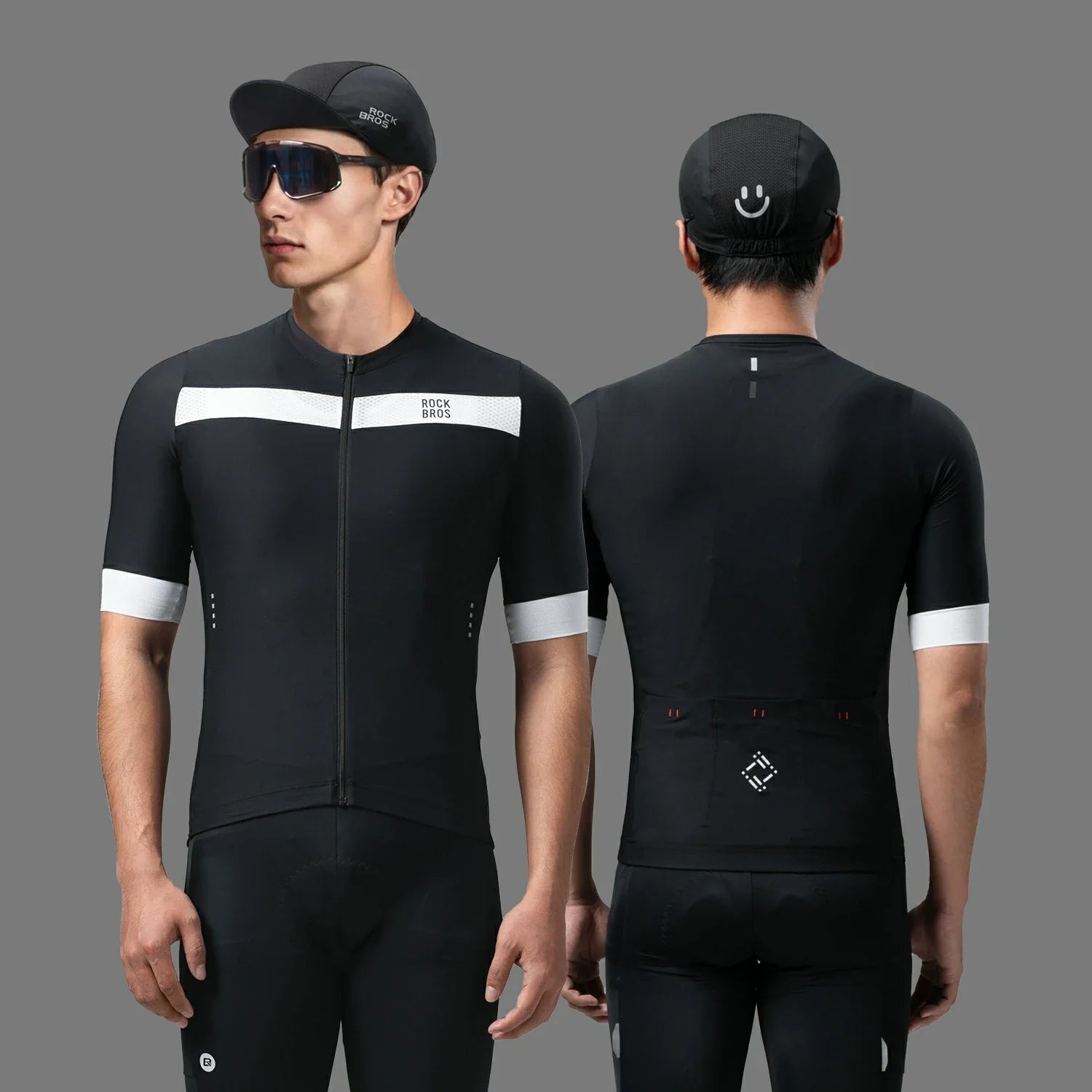 Cycling outfit with black jersey and shorts on a gray background