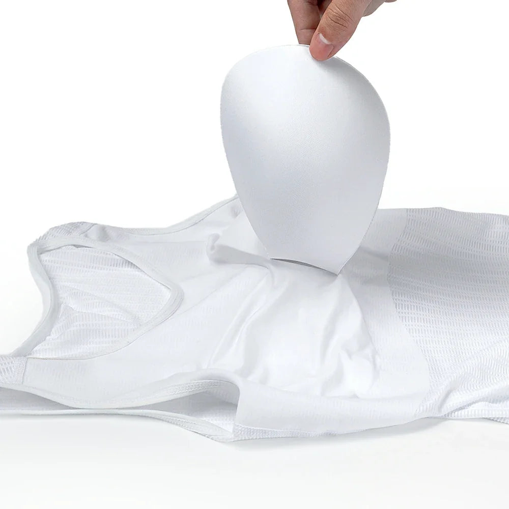 A white wireless bra or bralette with a mesh underband, shown with a hand holding a white silicone cup above it against a clean white background. #Color_Black