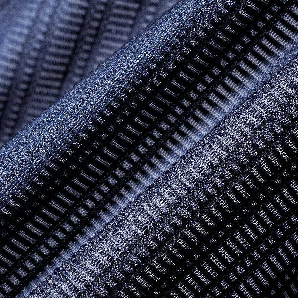 Close-up of textured blue fabric with a grid pattern