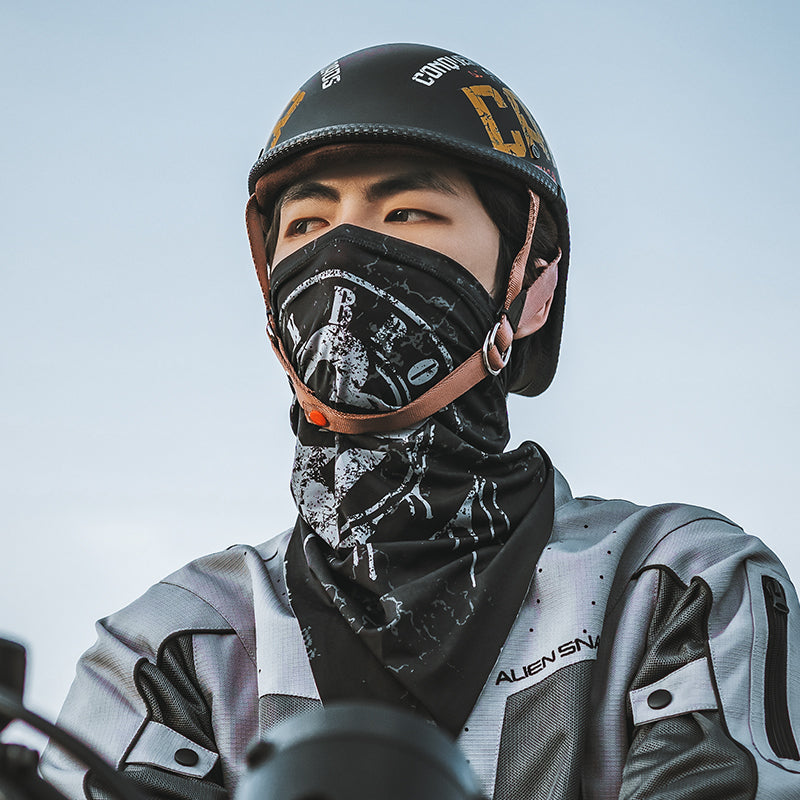 Person wearing a helmet and face mask with a gray background