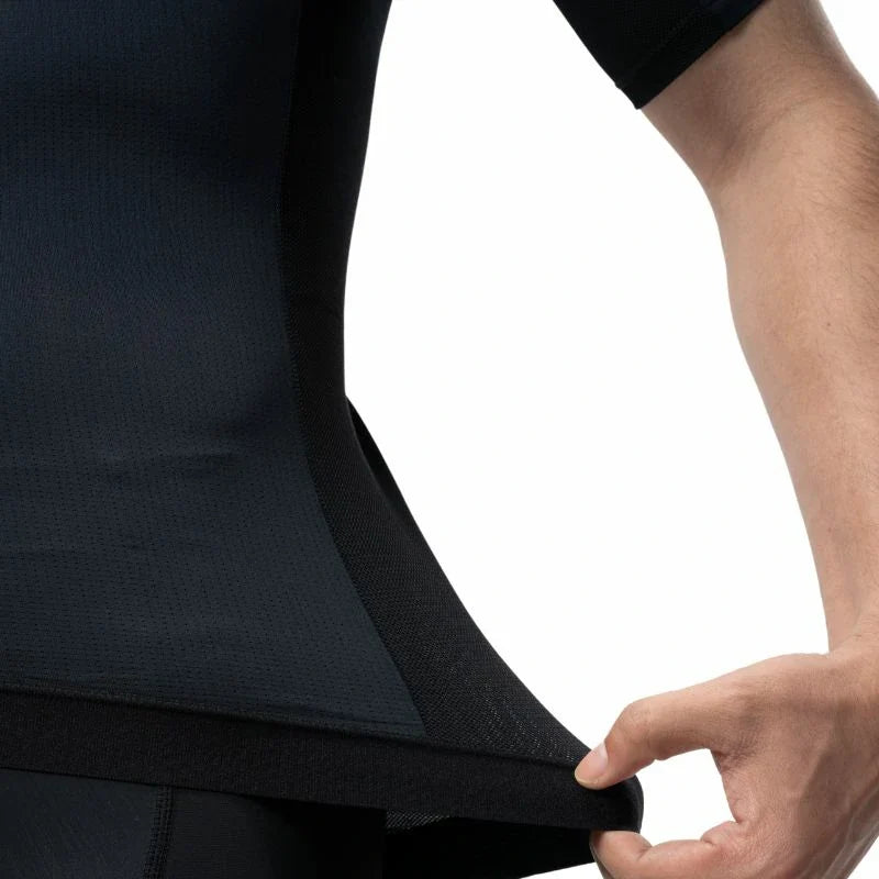 Person wearing a black suit with a close-up of the fabric texture. #Color_Black
