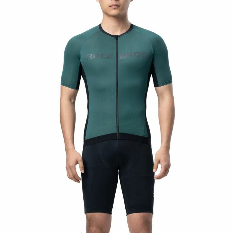 Person wearing a green and black cycling outfit with 'Ruckus' branding on a white background #Color_Green