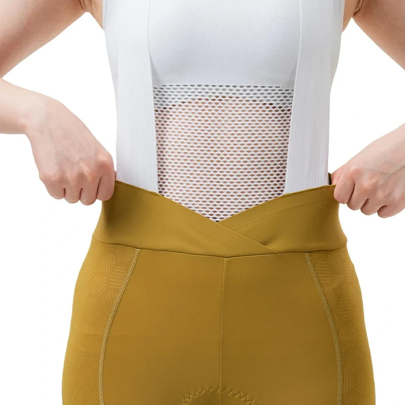 Person wearing mustard yellow athletic pants with a white mesh top on a light background #color_Yellow