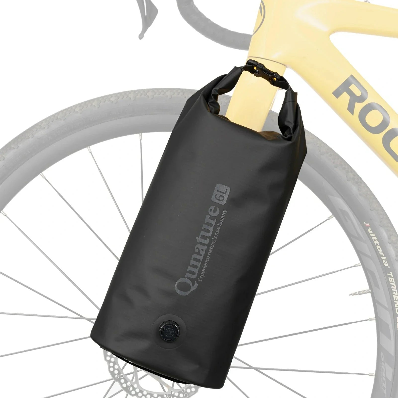 Black Quanature bikepacking bag attached to a bicycle wheel