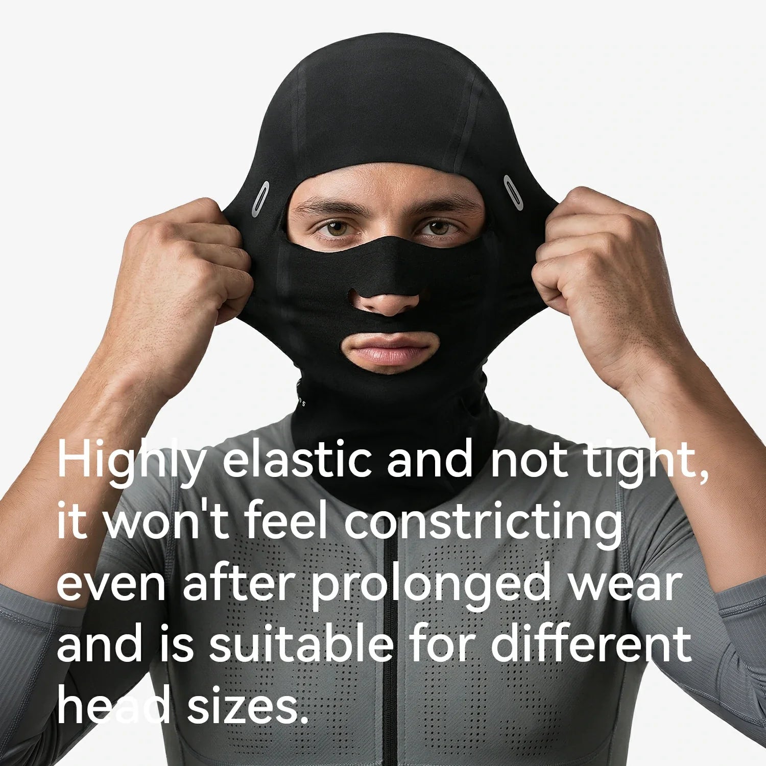 Person wearing a black balaclava with text about its elasticity and suitability for different head sizes.