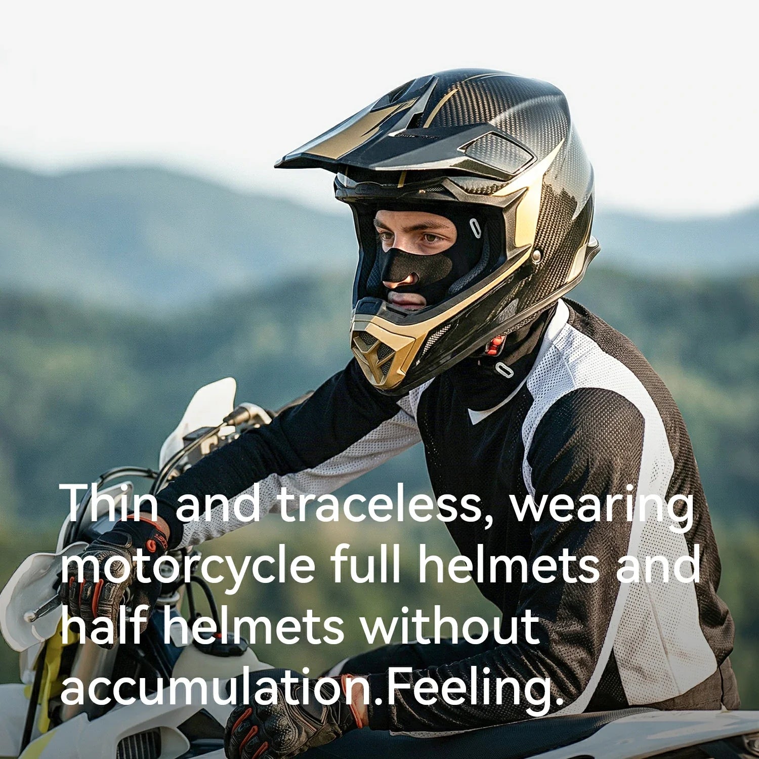 Person wearing a motorcycle helmet with scenic background